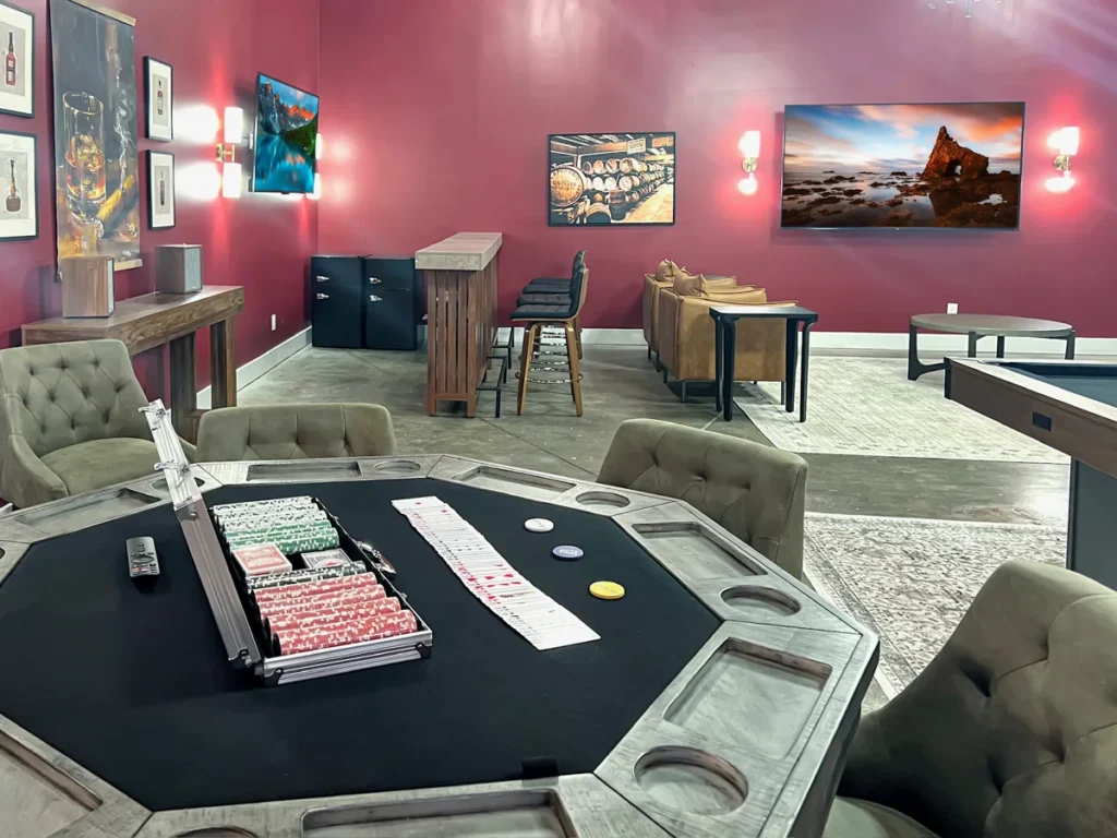 Separate Farmhouse Game Barn with shuffleboard, games, and bar seating