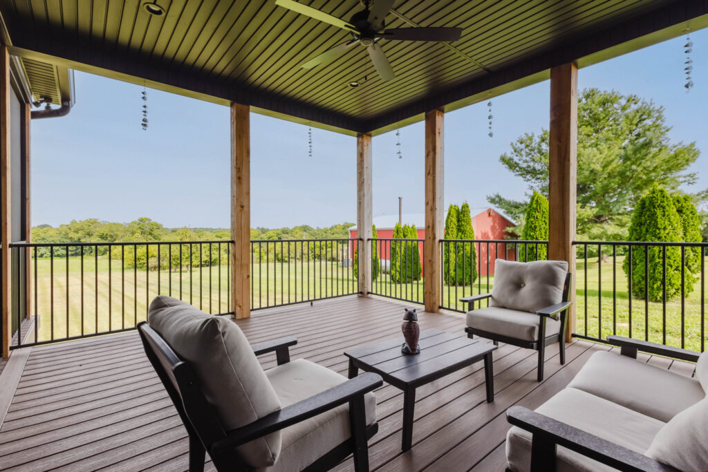 Covered porch overlooking the pasture at The Lodge