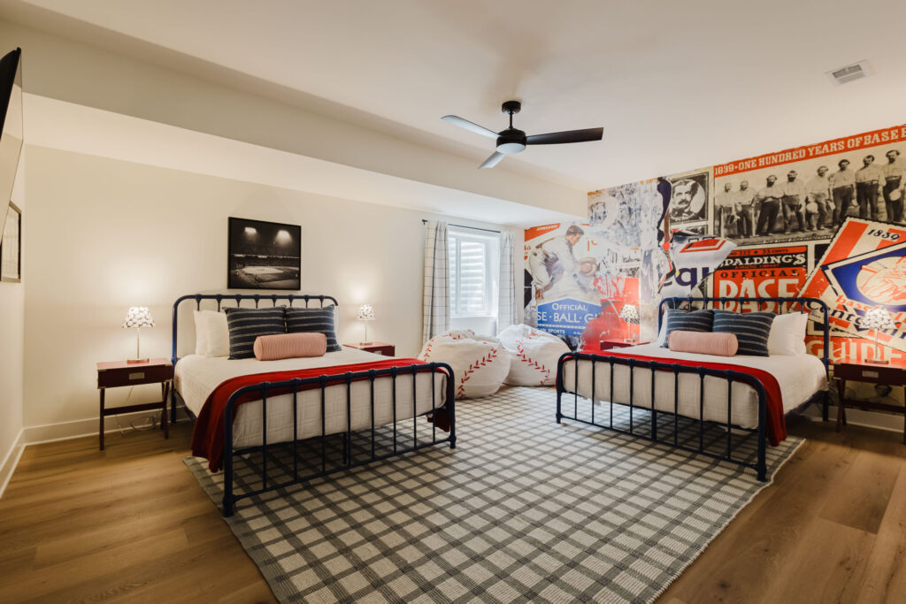 Louisville Slugger bedroom with two queen beds and baseball-themed decor