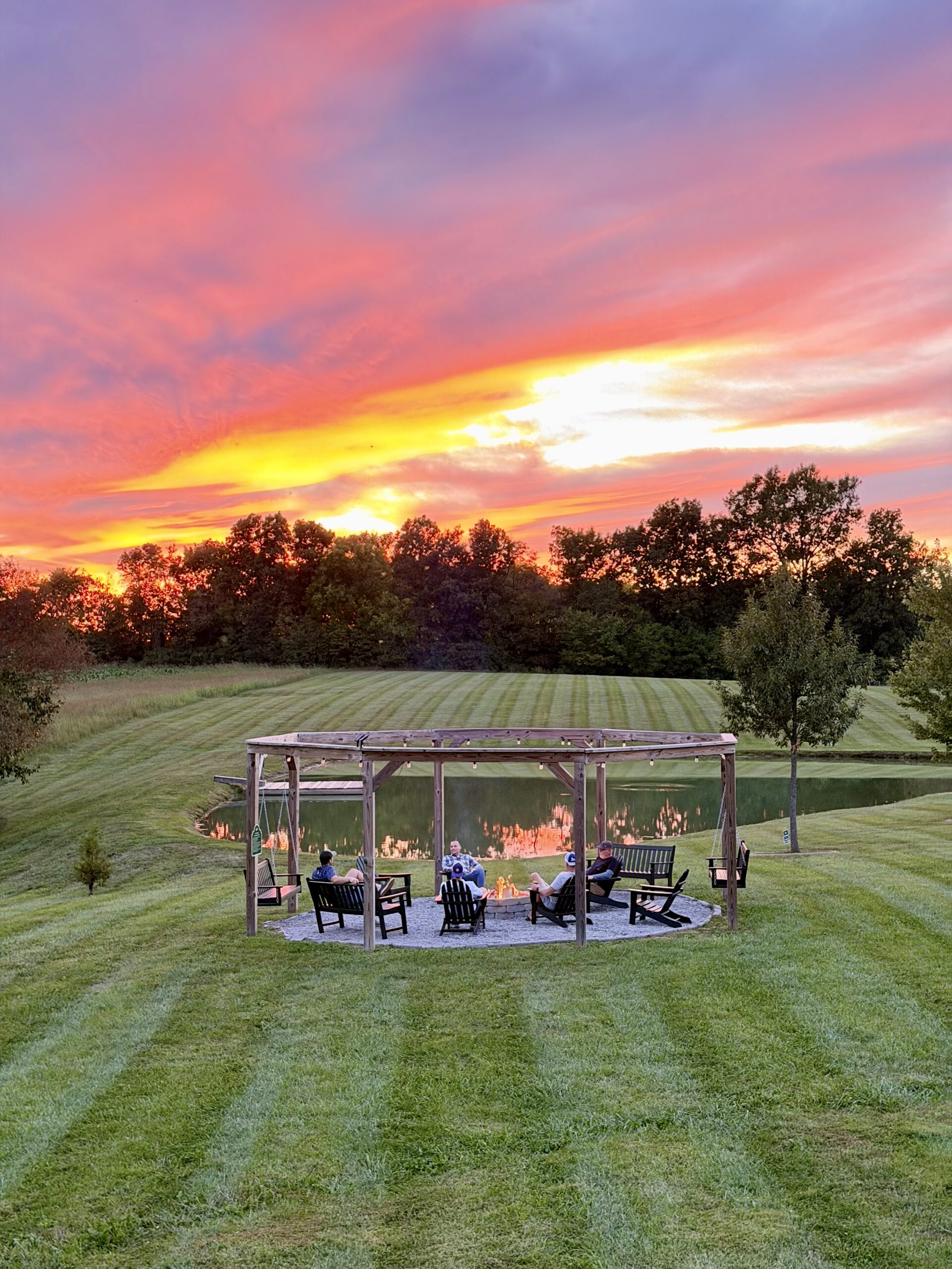 white dog lodge fire pit at sunset